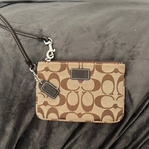Small brown fabric Coach wristlet